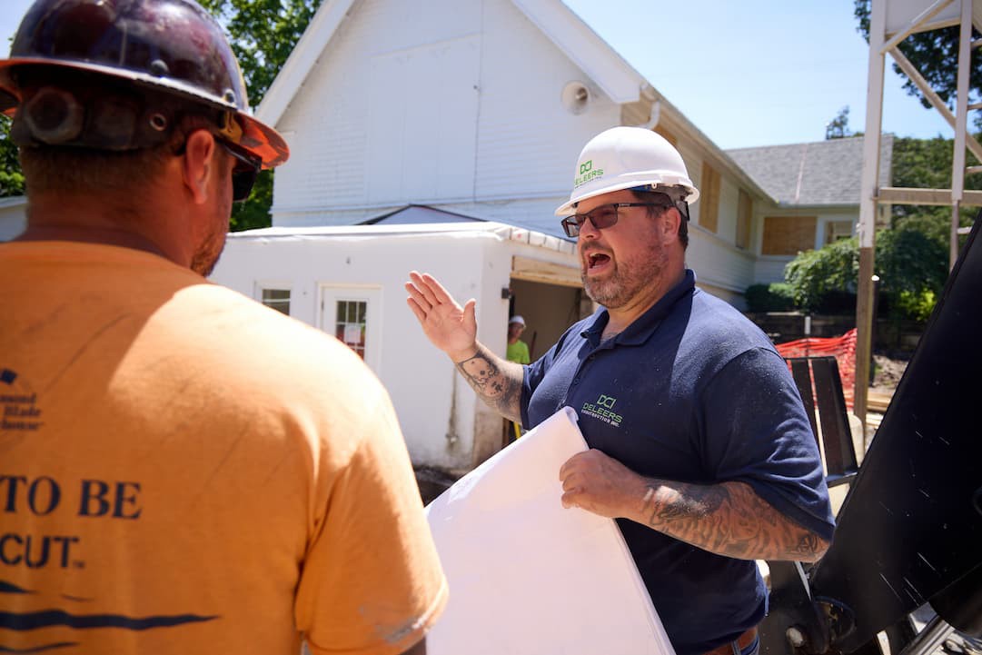 General contractor and a woman planning the commercial project