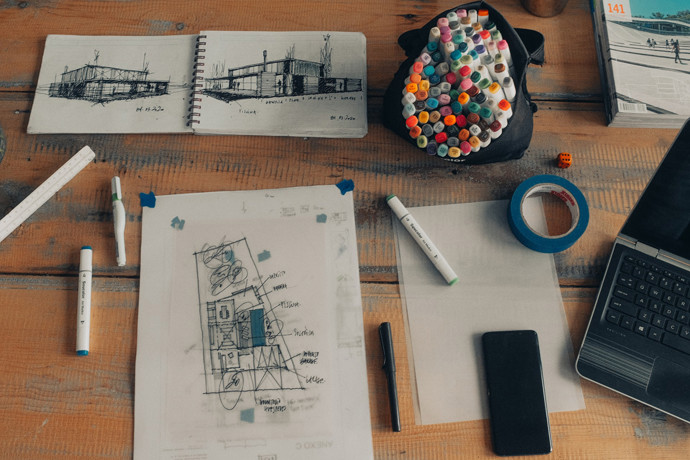 home construction plan with markers around it 
