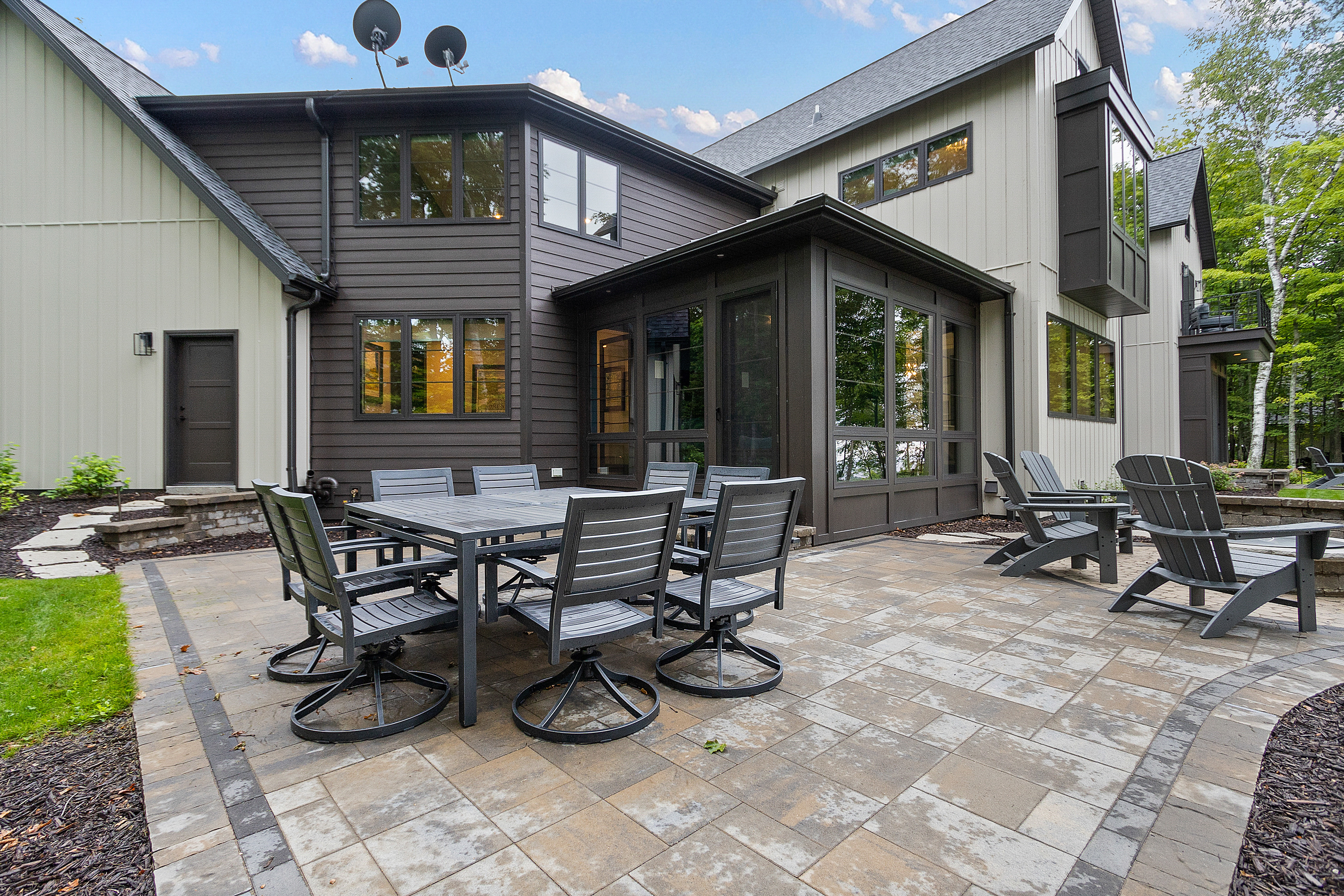 exterior renovation, deck with chairs, the wooden table, and mini kitchen 