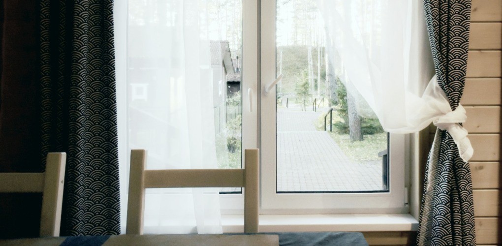 a window with green drapes 